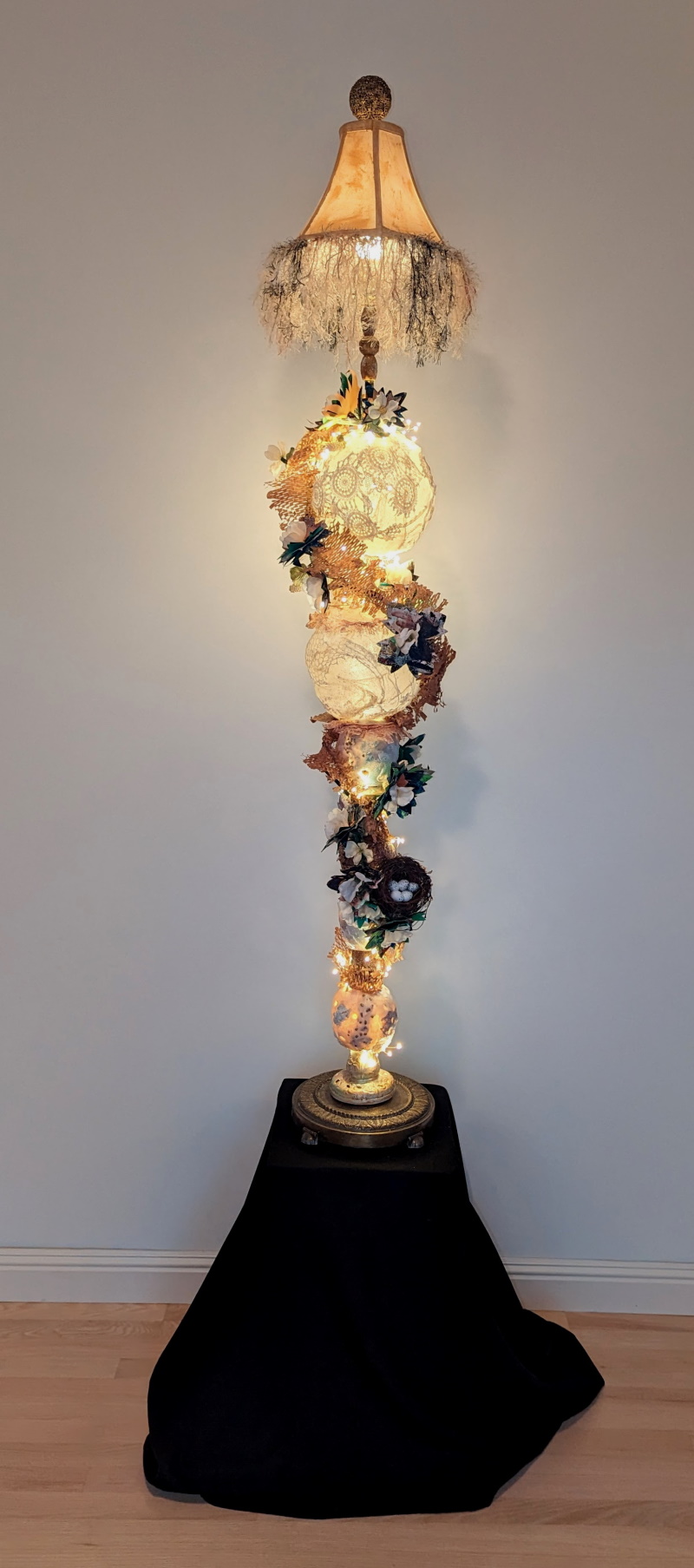 This is a Liminal 3D Assemblage Lamp. It is my first attempt to illuminate an assemblage work with electricity. Every element was made to illuminate from within and without.